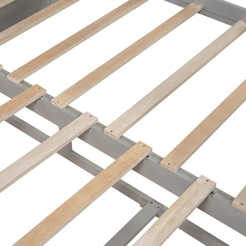 Cama nido clásica de madera con paneles laterales curvos y cajones de almacenamiento